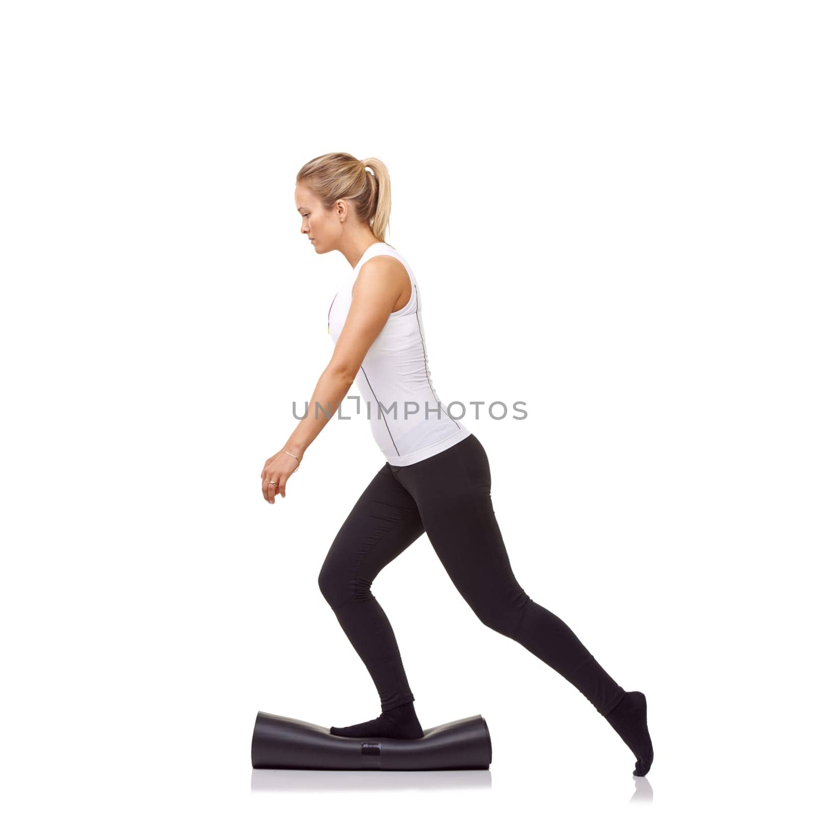 Woman, balance and mat in studio for fitness, pilates or workout for healthy body, wellness or exercise. Person, socks or yoga in sportswear for physical activity on mock up space or white background.