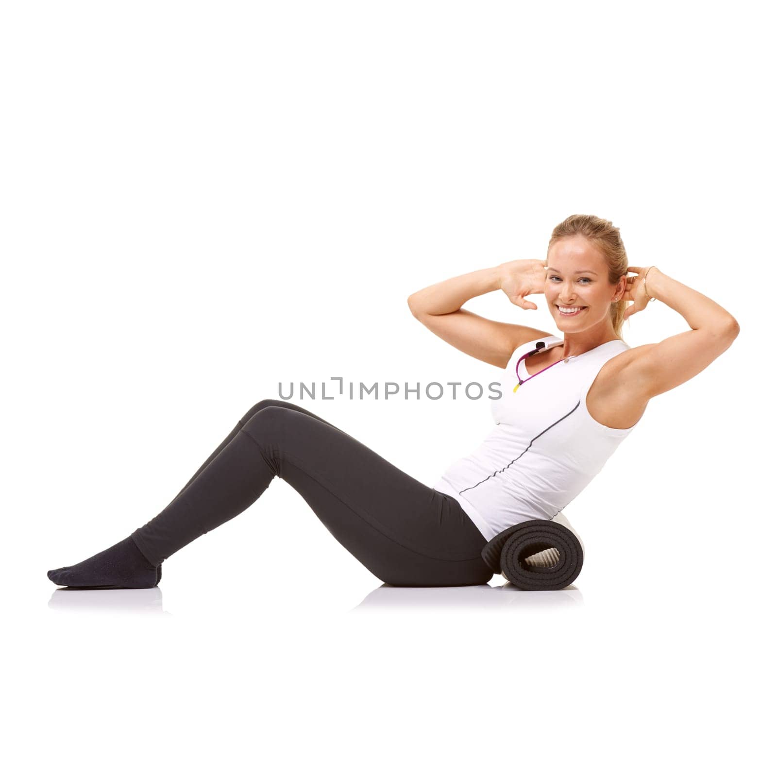 Woman, fitness and mat in studio for sit ups, pilates or workout for healthy body, wellness and core muscle. Person, portrait and yoga or smile for abdomen health on mockup space and white background.