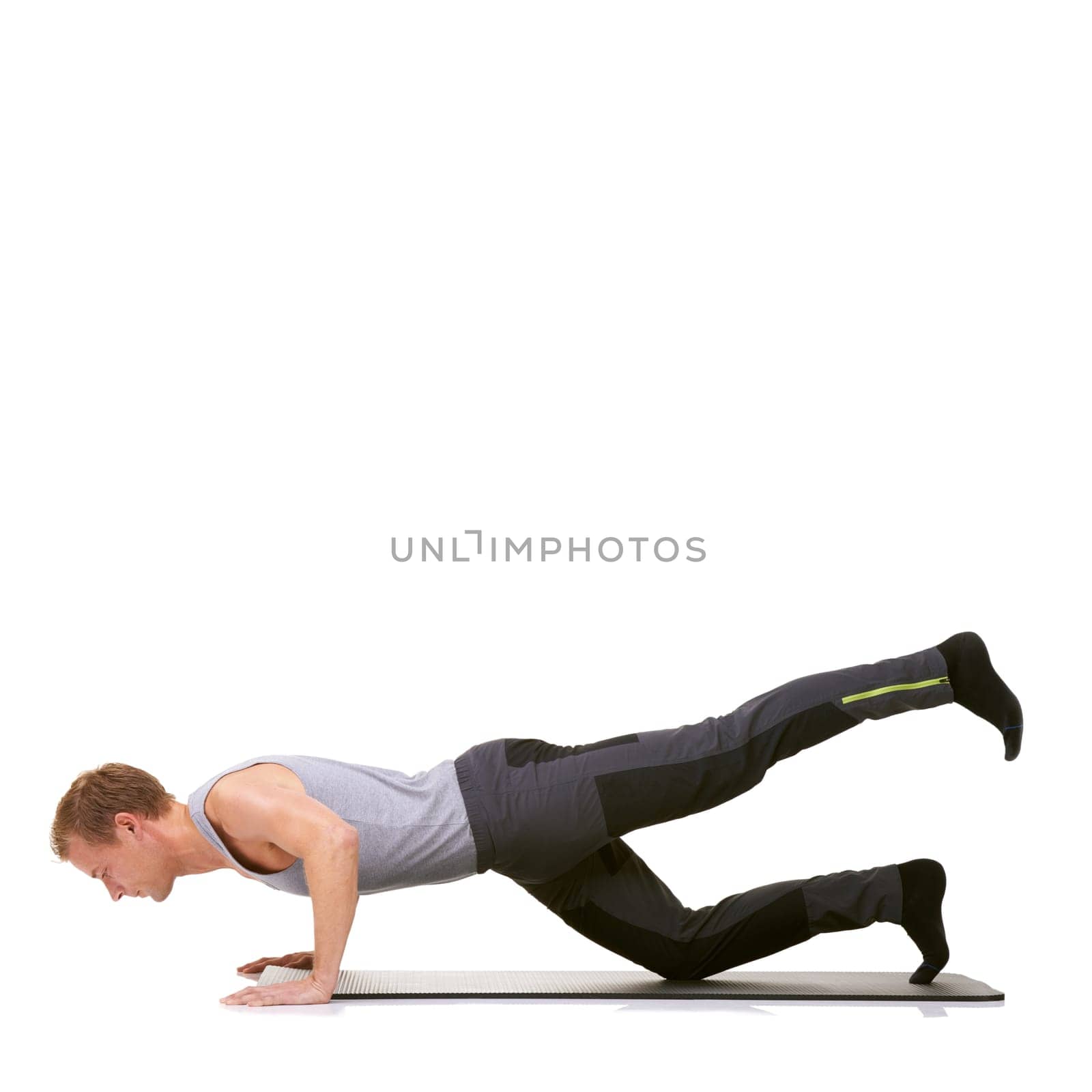 Man, pilates and mat in studio for stretching legs, fitness or workout for healthy body, wellness or core muscle. Person, exercise and yoga on floor for abdomen on mockup space or white background by YuriArcurs