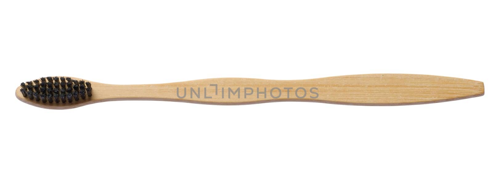 Wooden toothbrush on white isolated background, oral hygiene