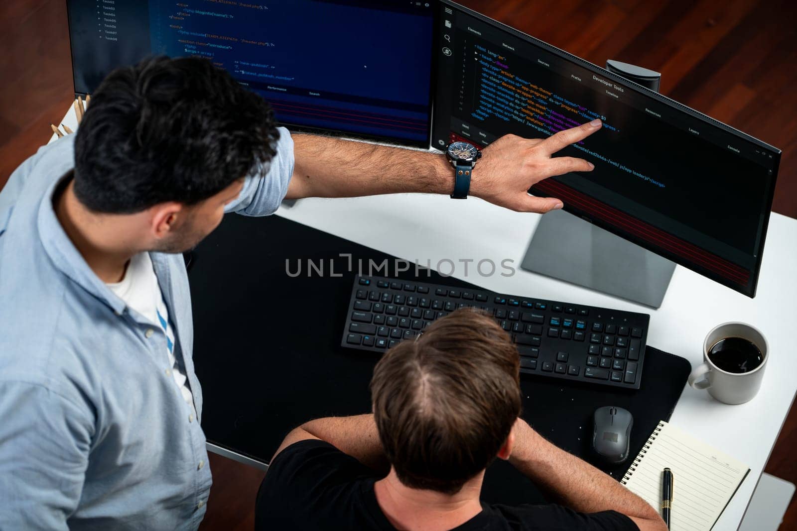 IT developers discussing online software development information on pc screen, creating program coding for latest version application on website. Concept of brainstorming firmware updated. Sellable.