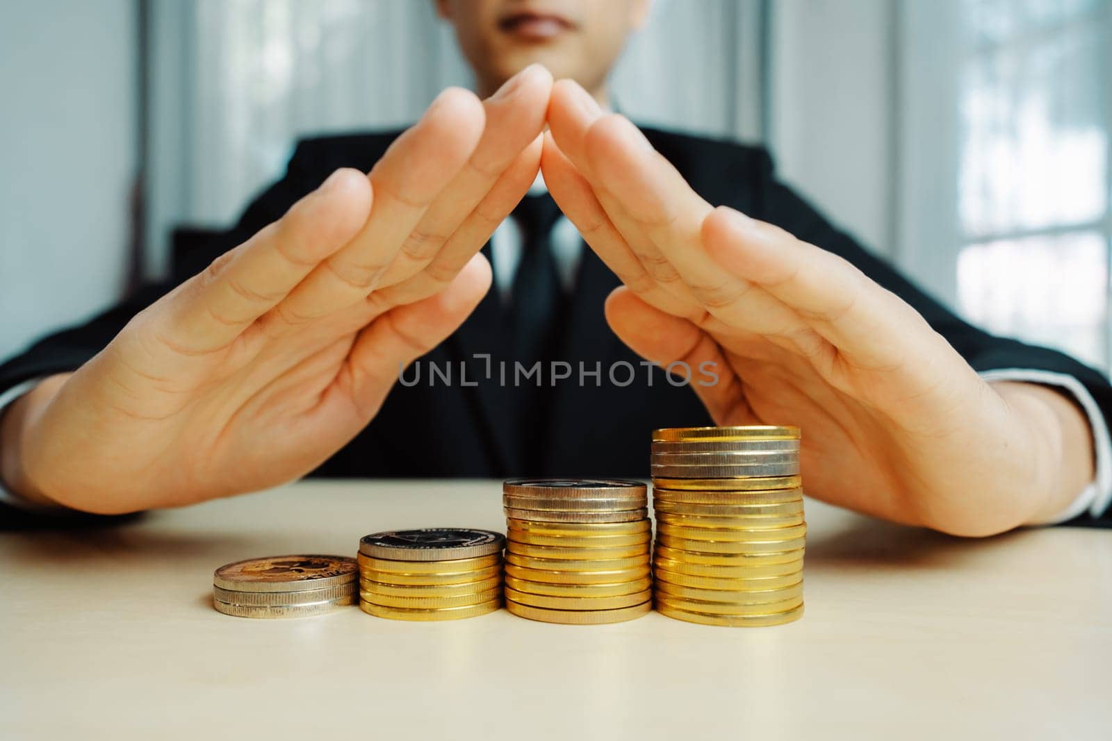 Businessman working with coin money currency. Concept of investment growth and money saving. uds