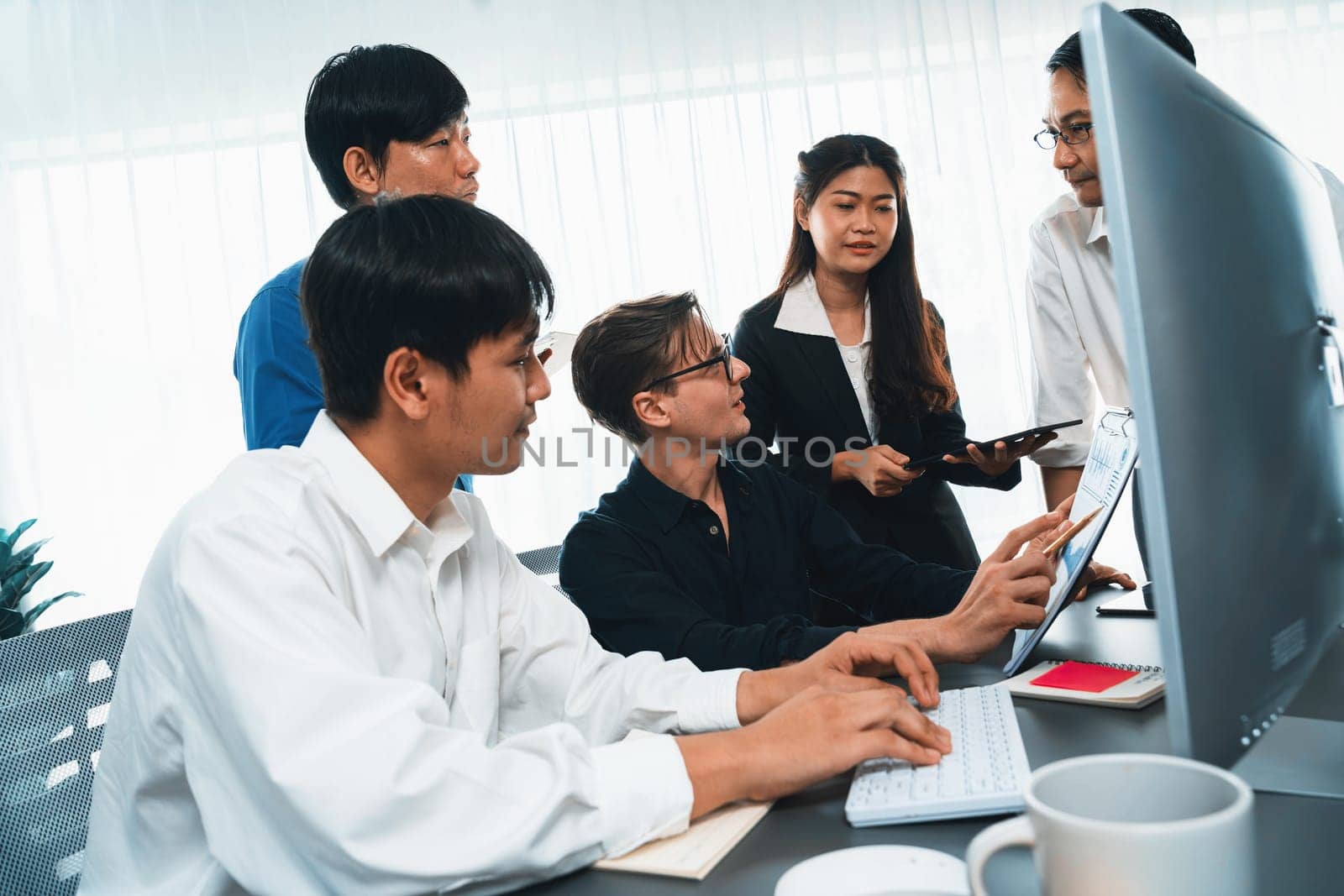 Group of diverse office worker employee working together on strategic business marketing planning in corporate office room. Positive teamwork in business workplace concept. Prudent