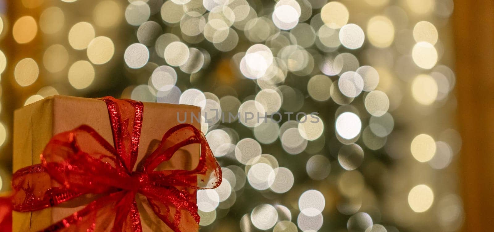 Christmas gift or present box, against magic bokeh background. Beautiful Christmas gift boxes with ribbon by Matiunina