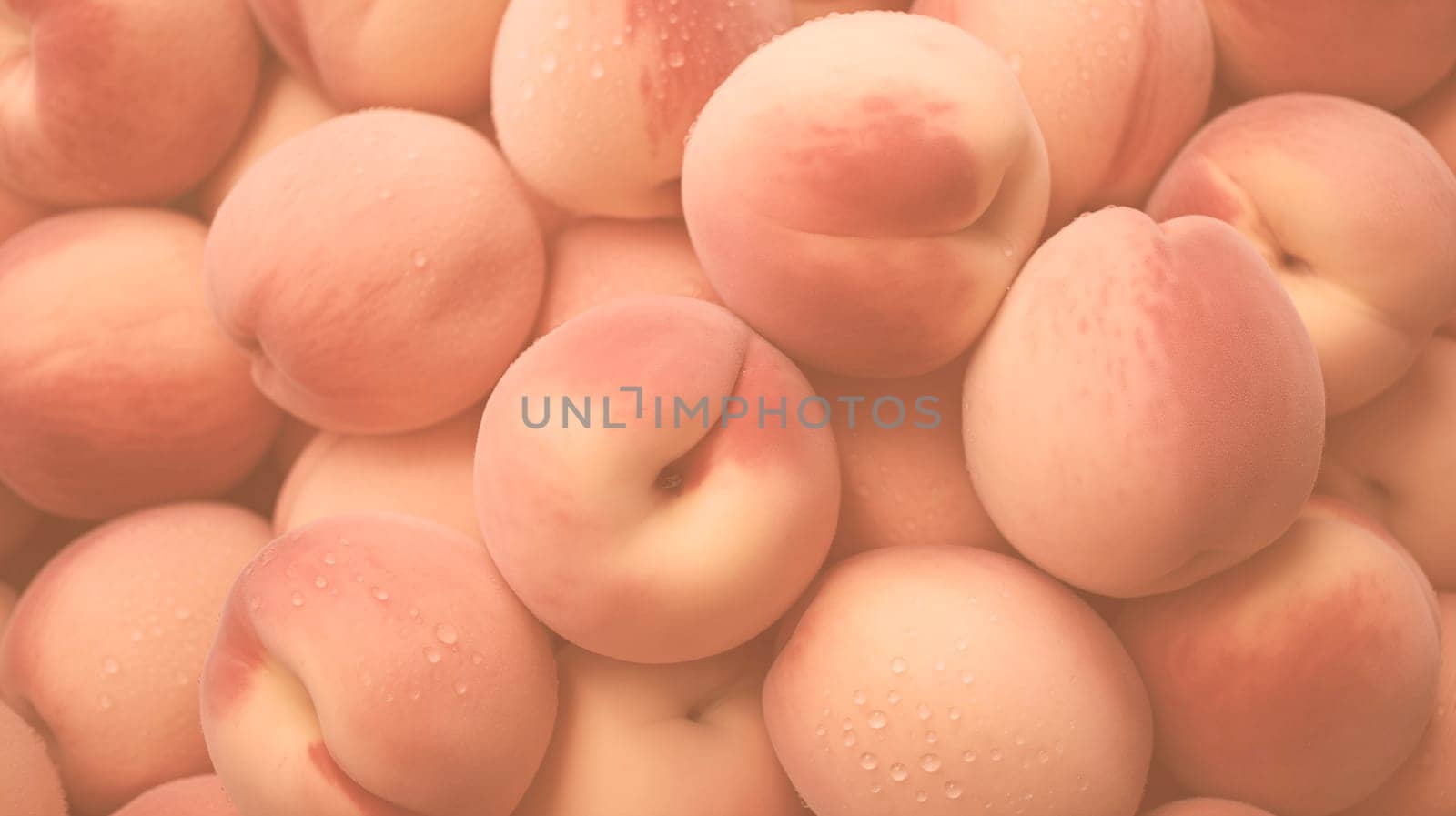 Close-up of peaches in trendy color Peach Fuzz. Monochrome background colors of 2024. High quality photo