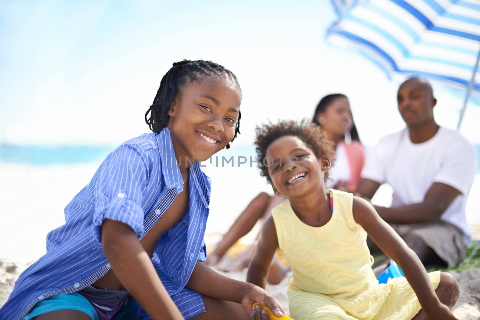 African family, parents or children and happy at beach for adventure, holiday or vacation in summer. African people, face and smile outdoor in nature for break, experience or bonding and relationship.