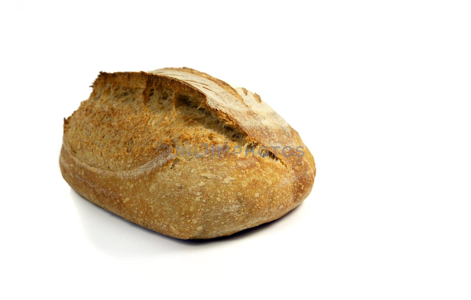 A fresh loaf of crusty sourdough bread isolated on white background