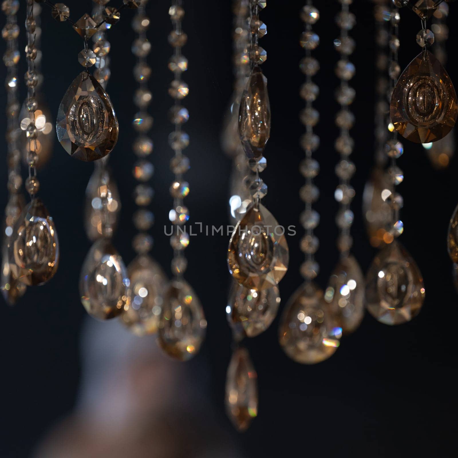 Crystal on a chandelier close-up on a dark background. by Niko_Cingaryuk