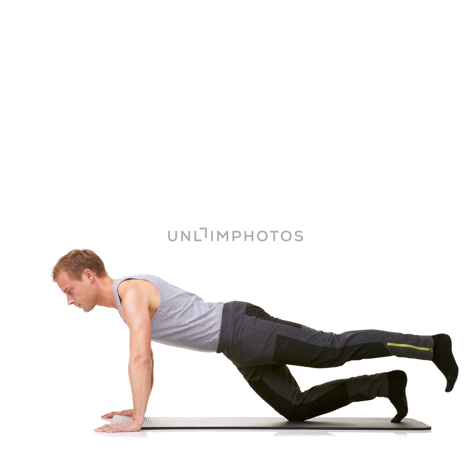 Man, pilates and mat in studio for stretching legs, fitness or workout for healthy body, wellness or core muscle. Person, exercise or yoga on floor for abdomen on mockup space or white background by YuriArcurs