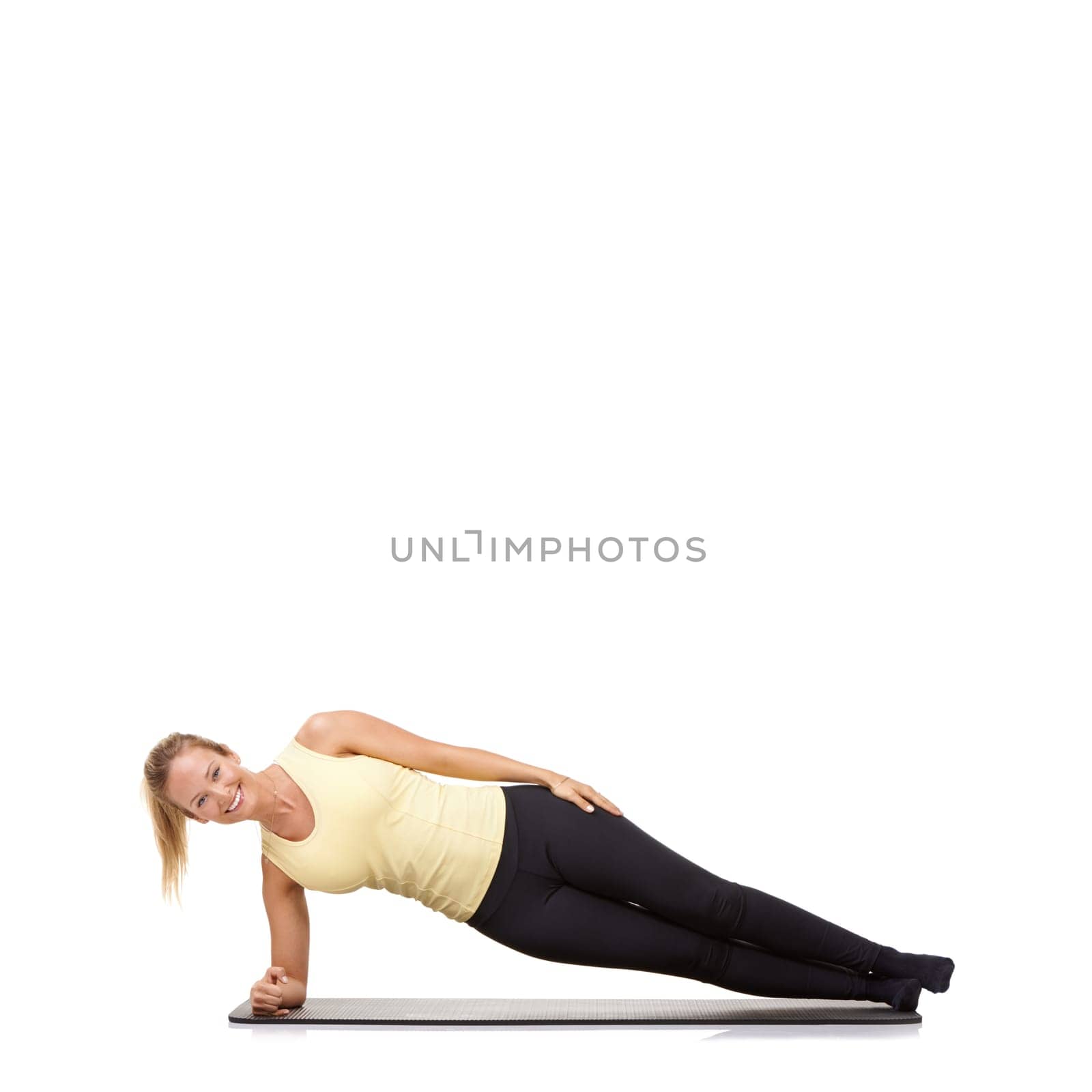 Woman, yoga and mat in studio with side plank, fitness or workout for healthy body, happy or core muscle. Person, portrait and pilates on floor for abdomen health on mockup space or white background.