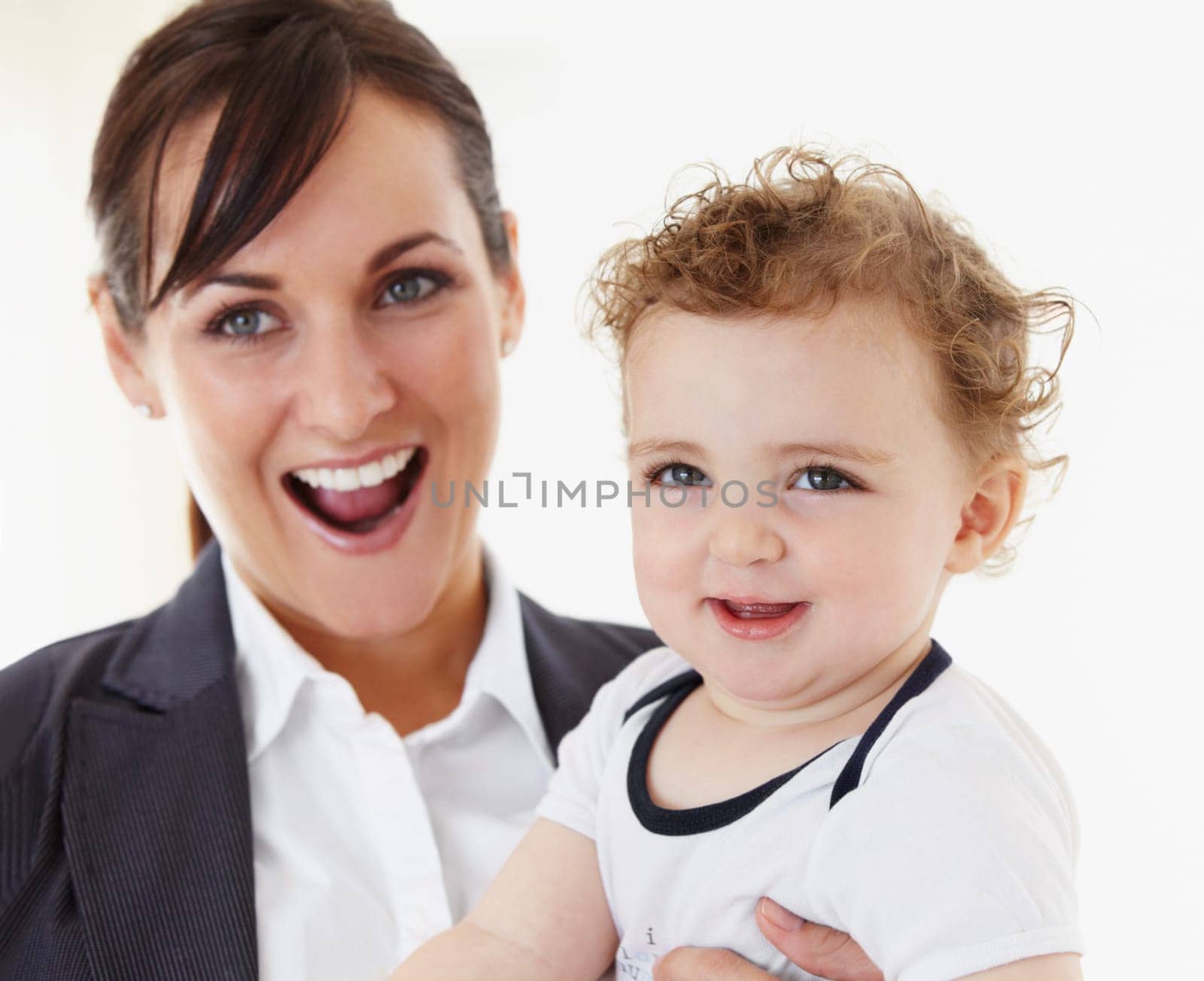 Happy, baby and mom in portrait with business, work and motherhood with a professional career. Mockup, space and woman in a suit smile with love, care and playing with child in home or morning by YuriArcurs