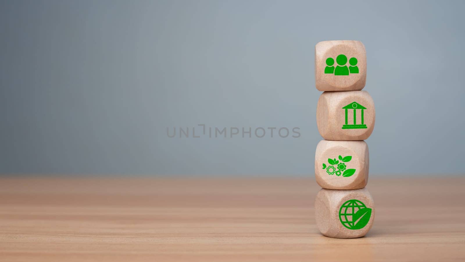 ESG concept of environmental, social and governance, wood block and icon on wooden background It is an idea for sustainable organizational development ​account the green environment. by Unimages2527