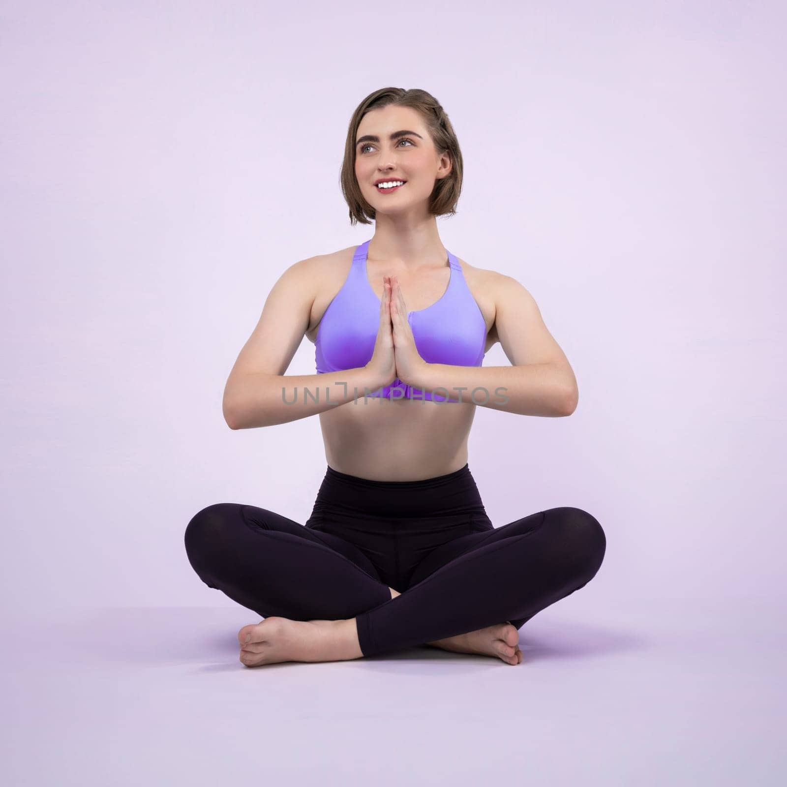 Full body length gaiety shot athletic and sporty woman doing healthy and meditative yoga exercise workout posture on isolated background. Healthy active and body care lifestyle