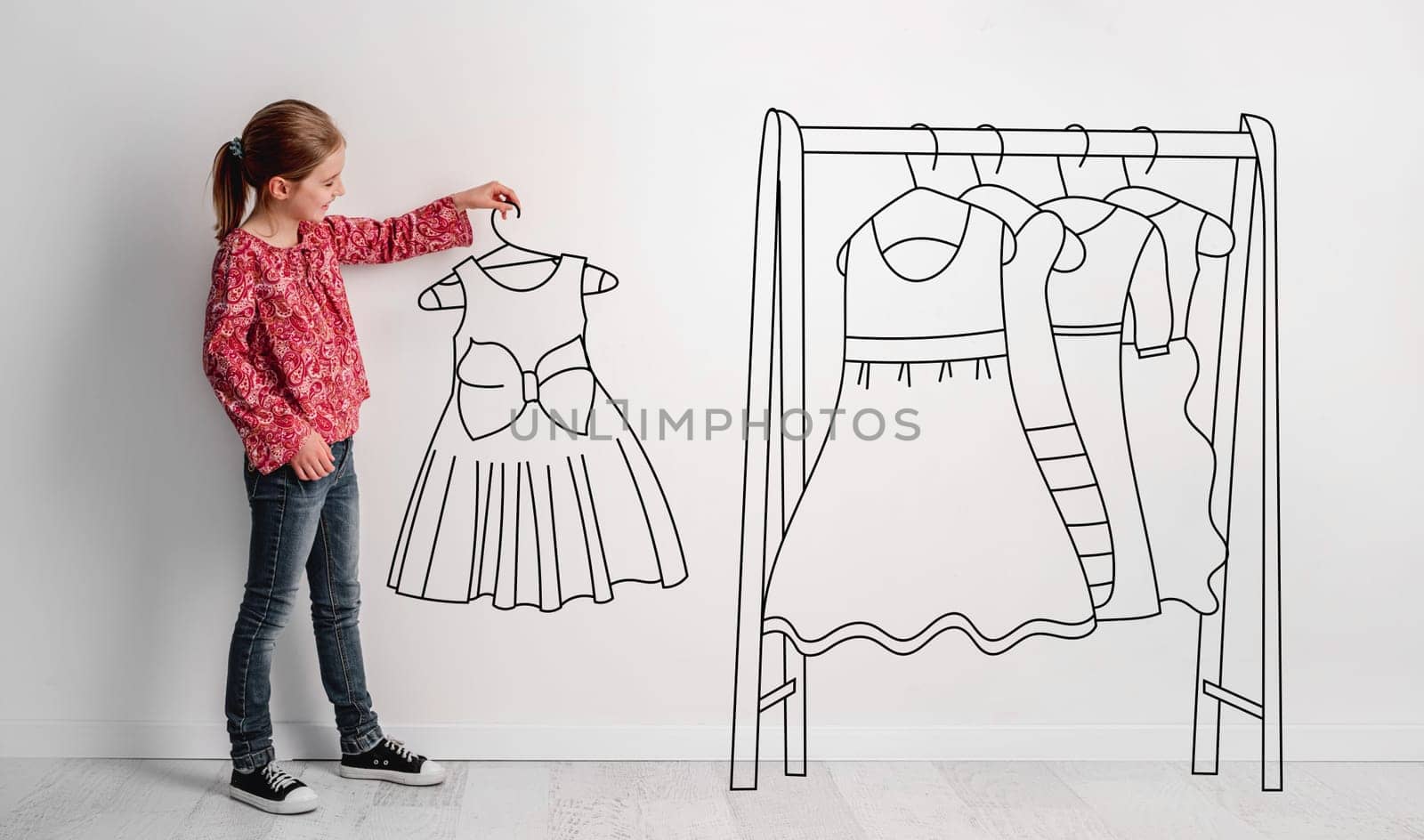 Photo Of Little Girl Holding Hand-Drawn Dress, With Illustrated Hanger And Dresses Nearby, Combines Photography And Illustration On The Theme Of Children'S Fashion