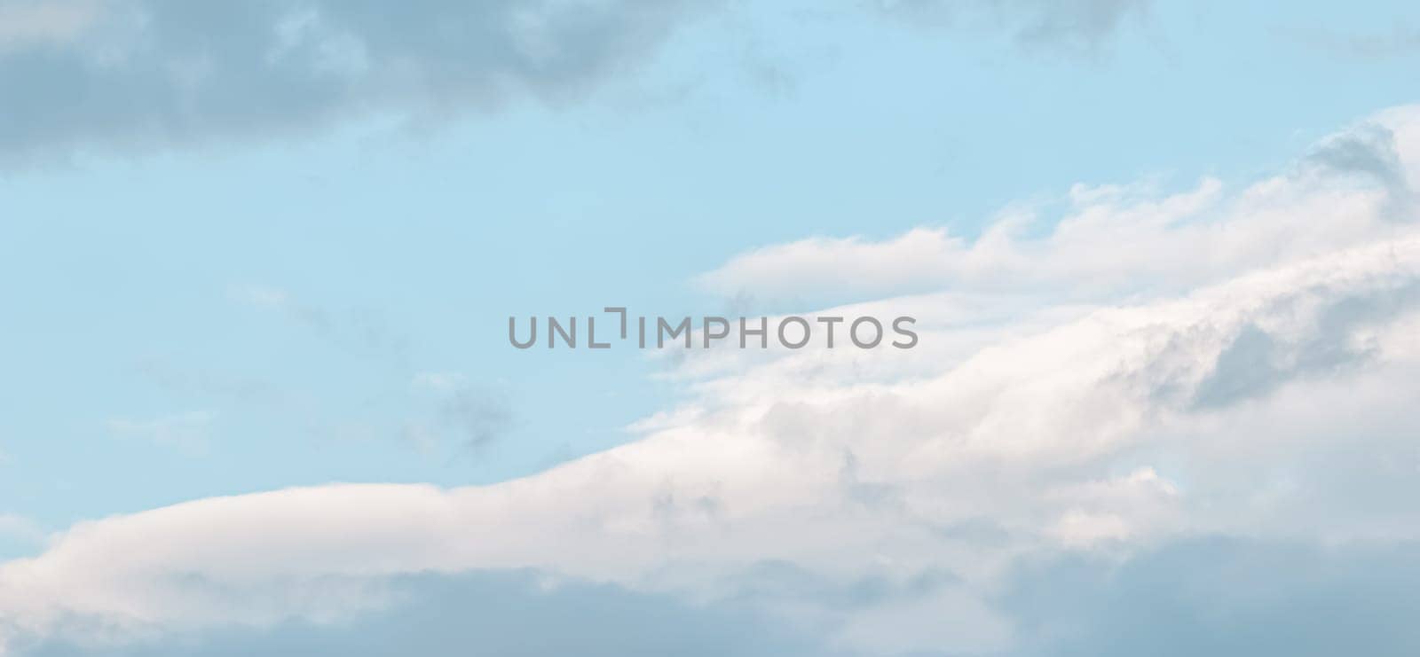 Background of blue sky with white clouds by Olayola