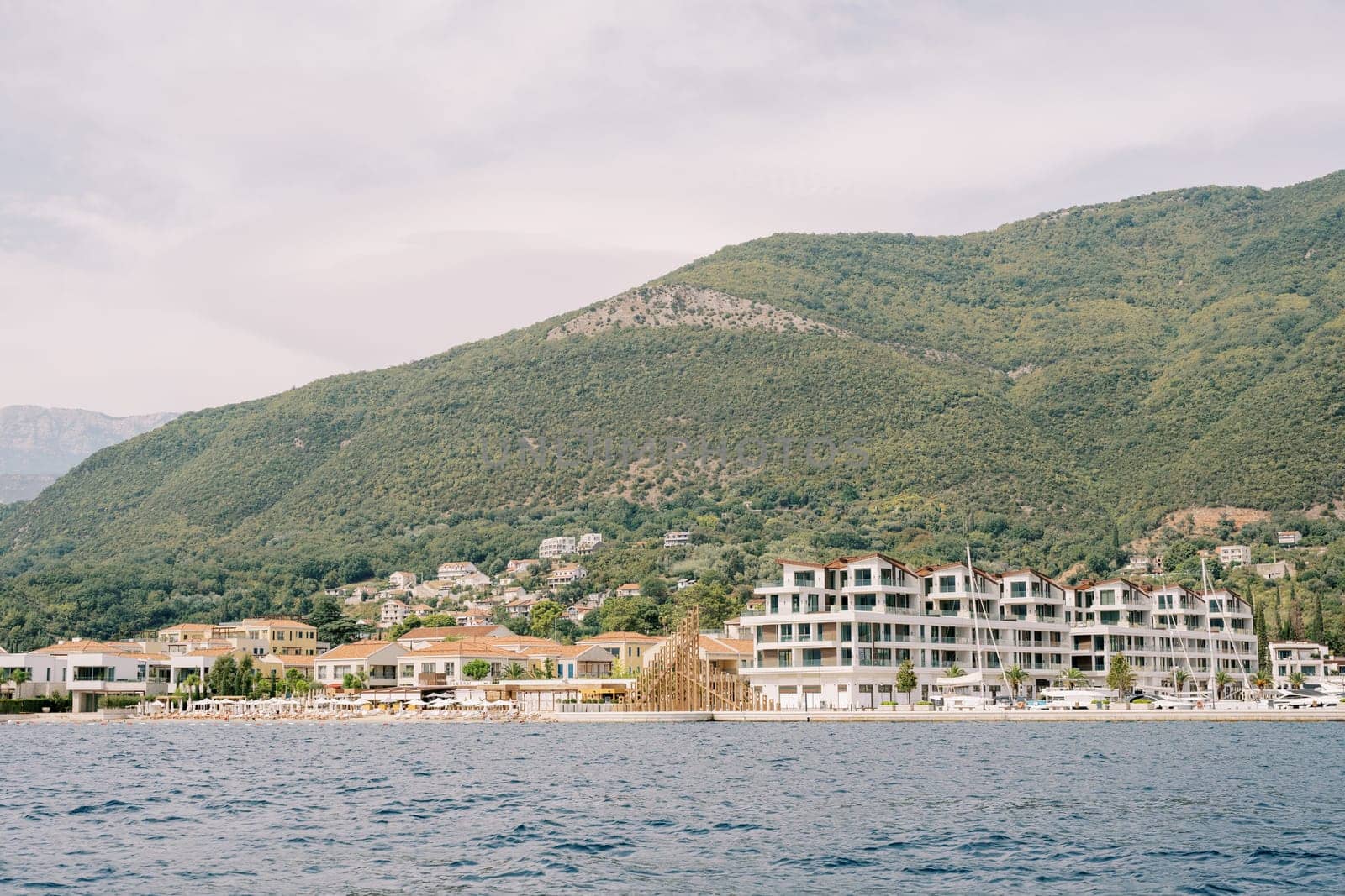 Multi-storey villas of the private hotel complex One and Only on the seashore. Portonovi, Montenegro. High quality photo