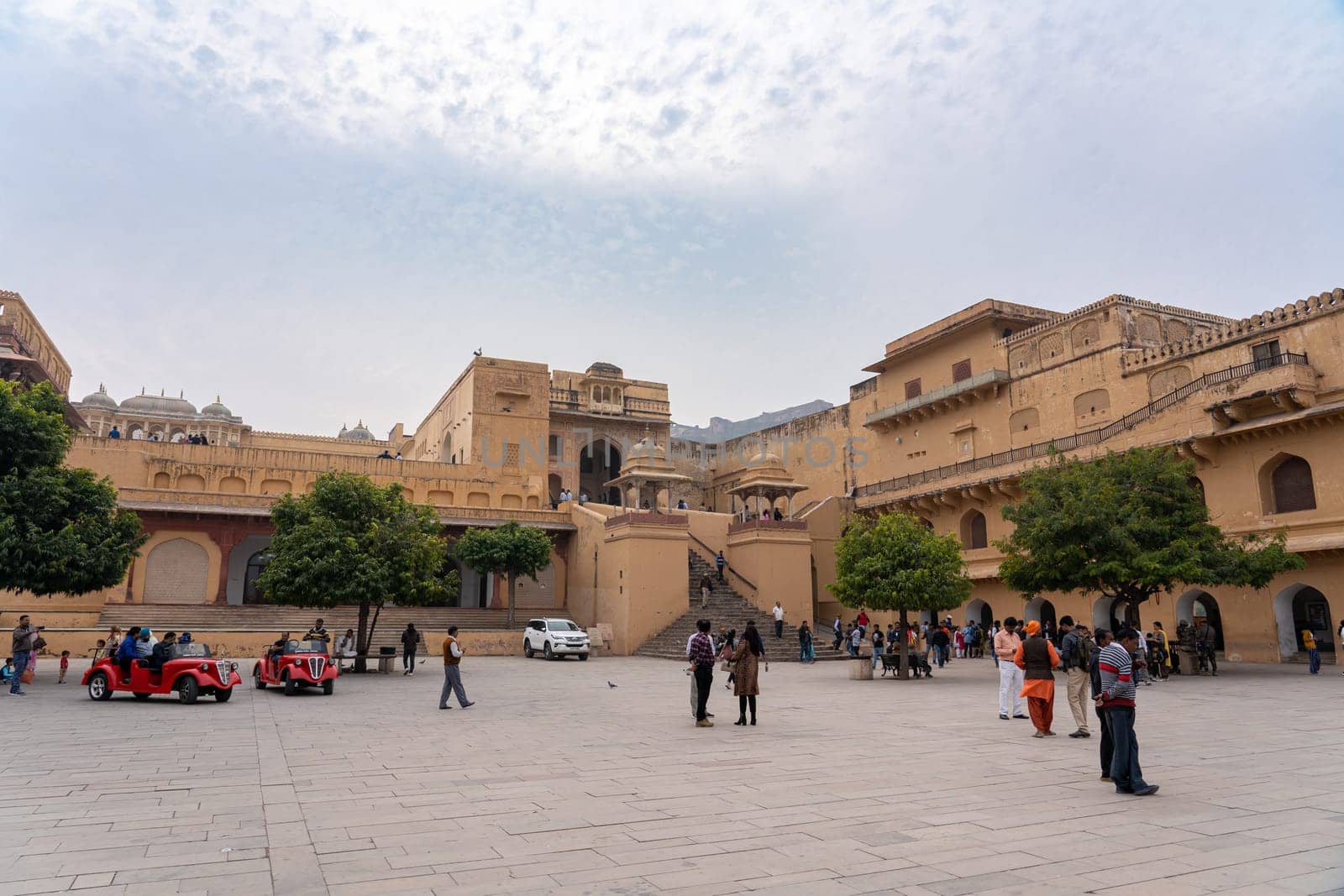 Jaipur, India - December 12, 2019: People in the courtyard at historic Amber Fort