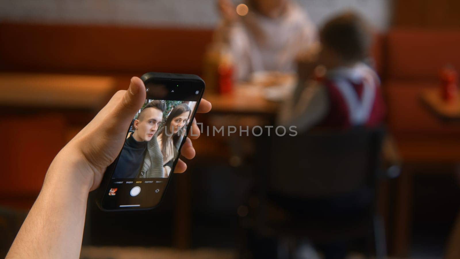Beautiful couple takes selfie on date. Stock footage. Attractive couple takes selfie on date in cafe. Beautiful young couple takes selfie in cafe by Mediawhalestock
