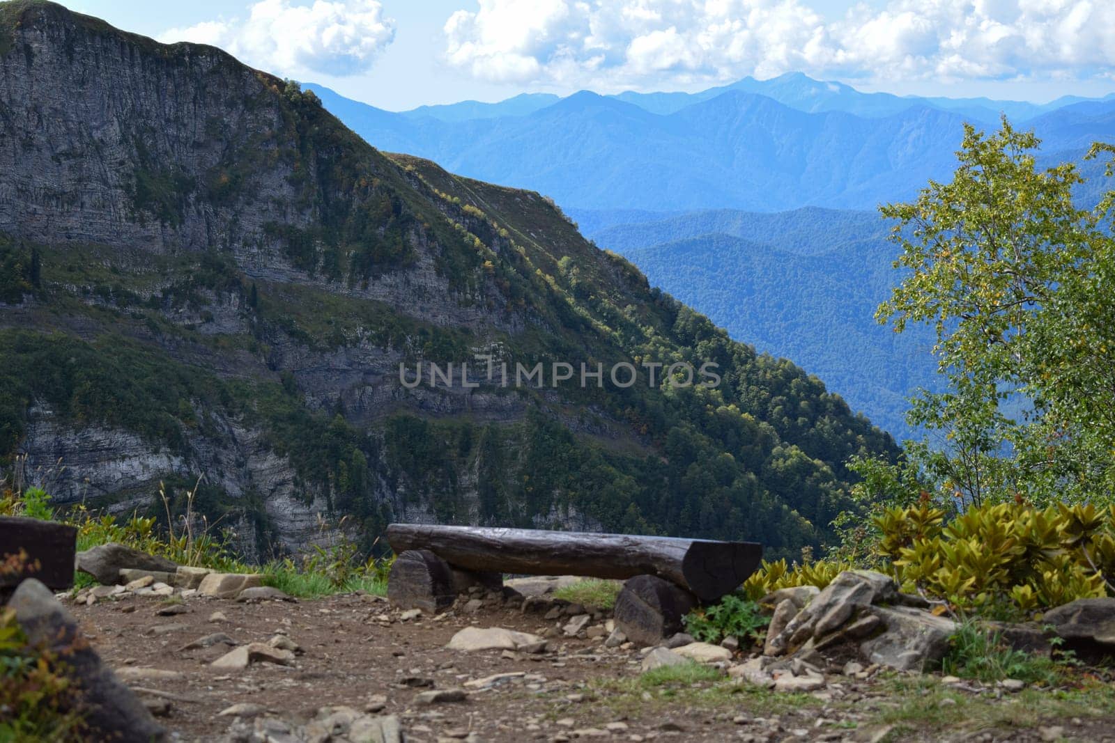 A wooden bench sitting on top of a mounteins, featured on flickr, neo-romanticism, creative commons attribution