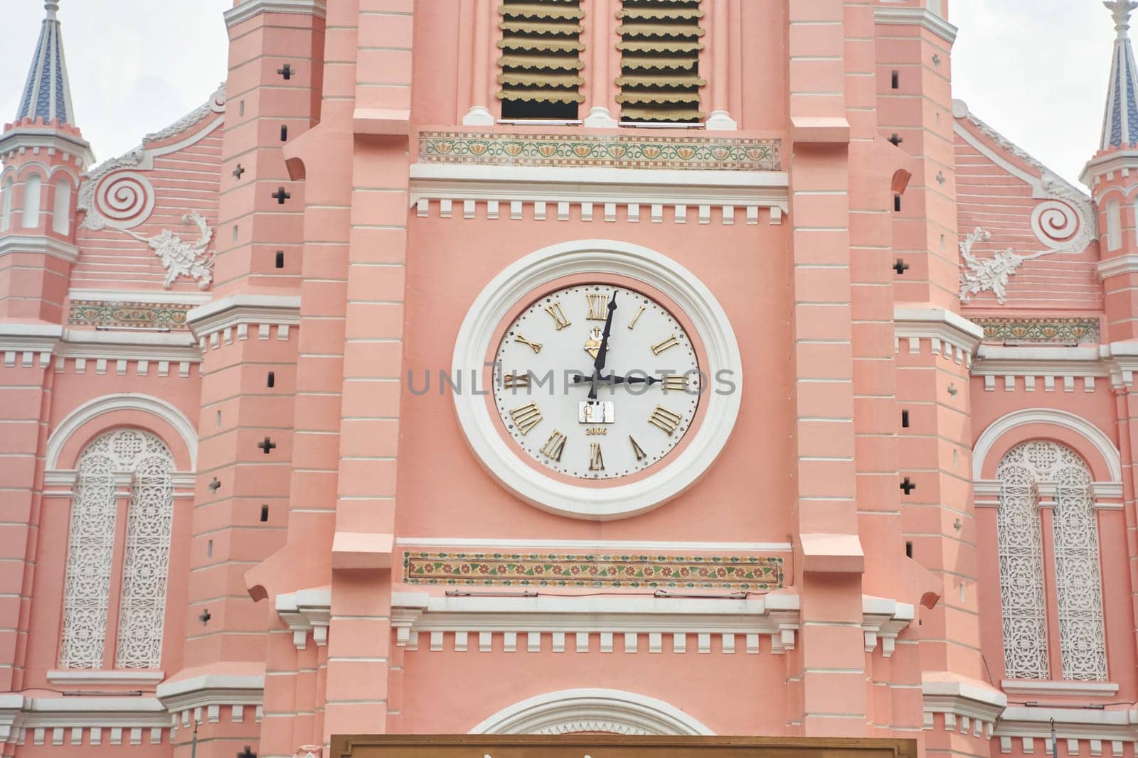 Ho Chi Minh City, Vietnam - 03.07.2023: View of the pink Tan Dinh church by driver-s