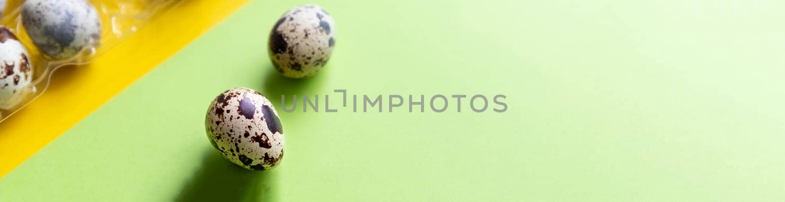 Creative quail egg layout on brown background. Quail eggs pattern. Happy easter concept.