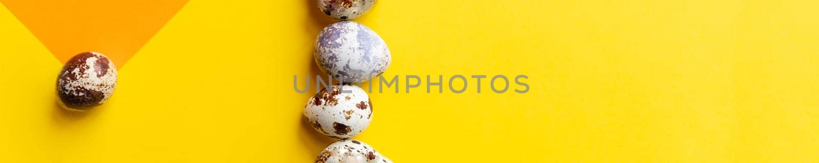 Creative quail egg layout on brown background. Quail eggs pattern. Happy easter concept.