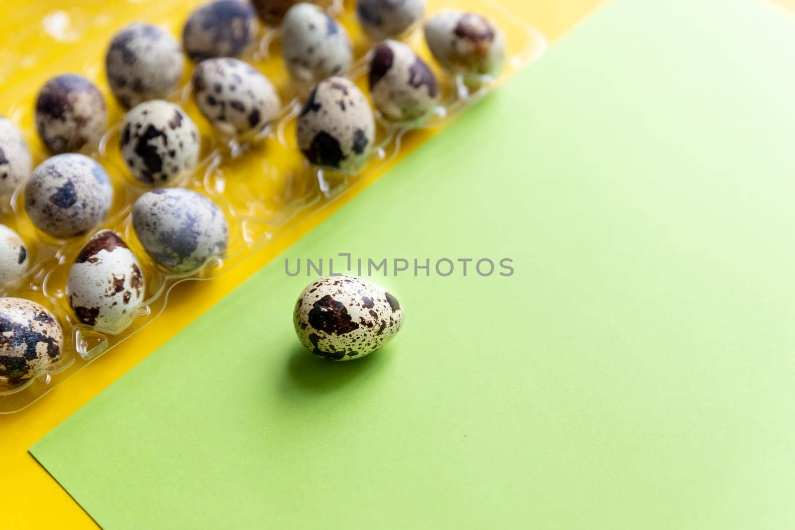Creative quail egg layout on colorful background. Quail eggs pattern. Happy easter concept. Minimal design. flat lay, eggs pattern. Springtime Banner with Copy space by YuliaYaspe1979