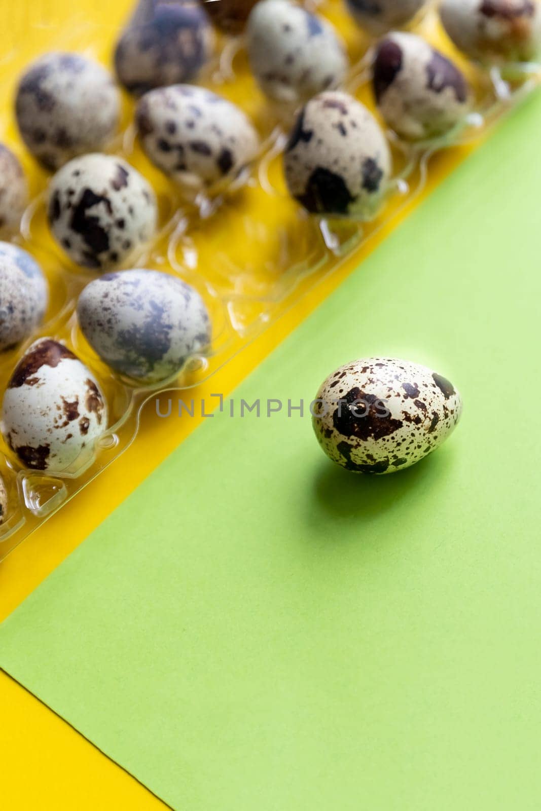 Creative quail egg layout on colorful background. Quail eggs pattern. Happy easter concept. Minimal design. flat lay, eggs pattern. Springtime Banner with Copy space by YuliaYaspe1979