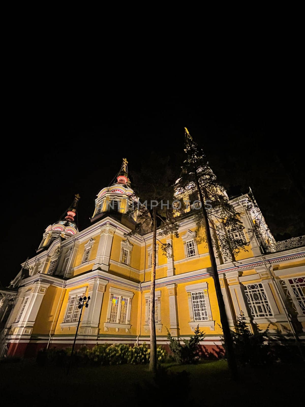 Orthodox Cathedral in the park in Almaty at night.