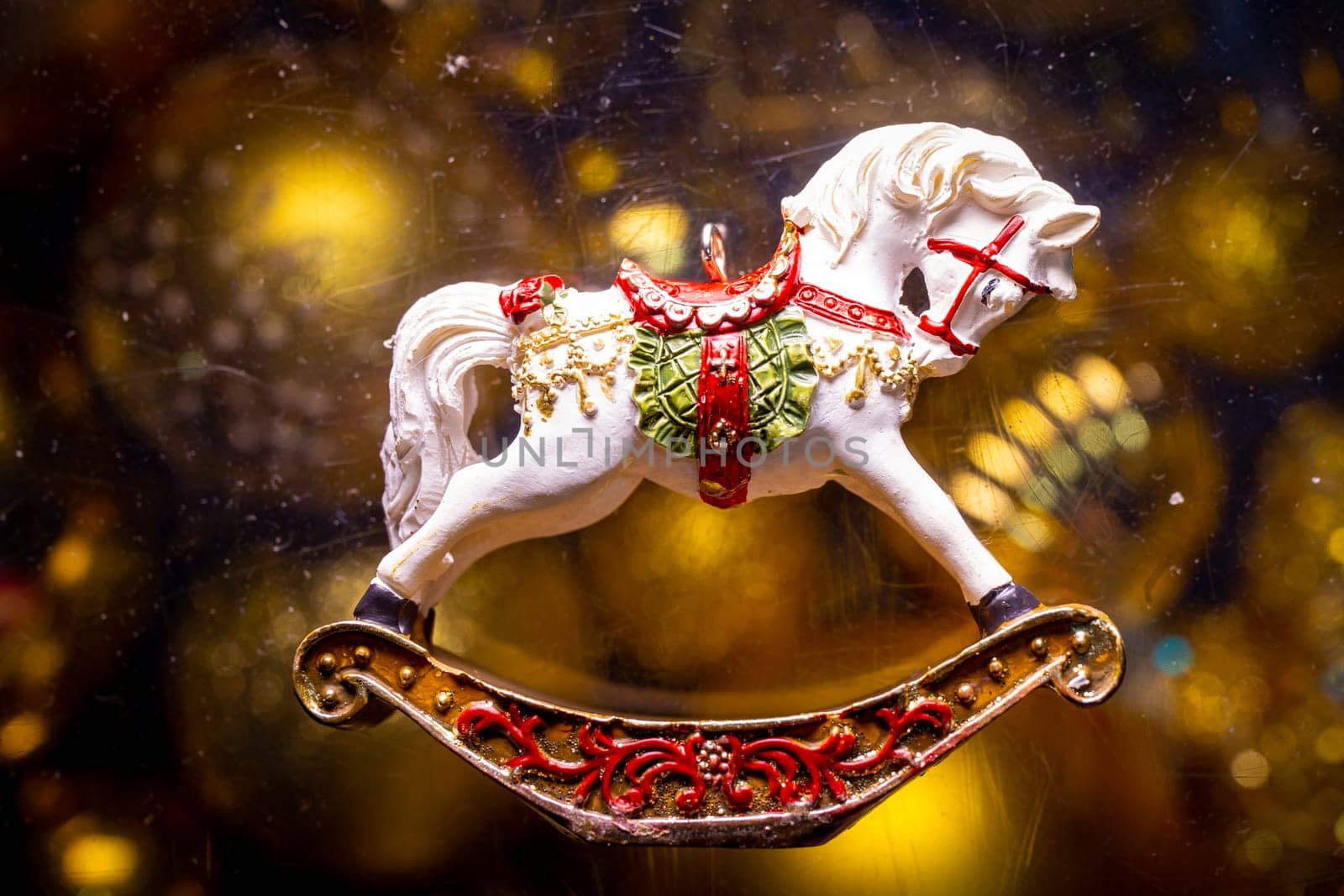 new year retro toy horse on a golden background by Pukhovskiy