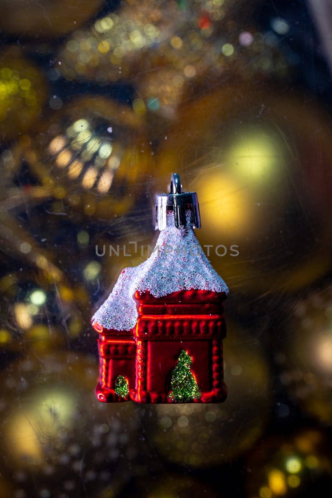 christmas tree toy christmas red house on a golden background.