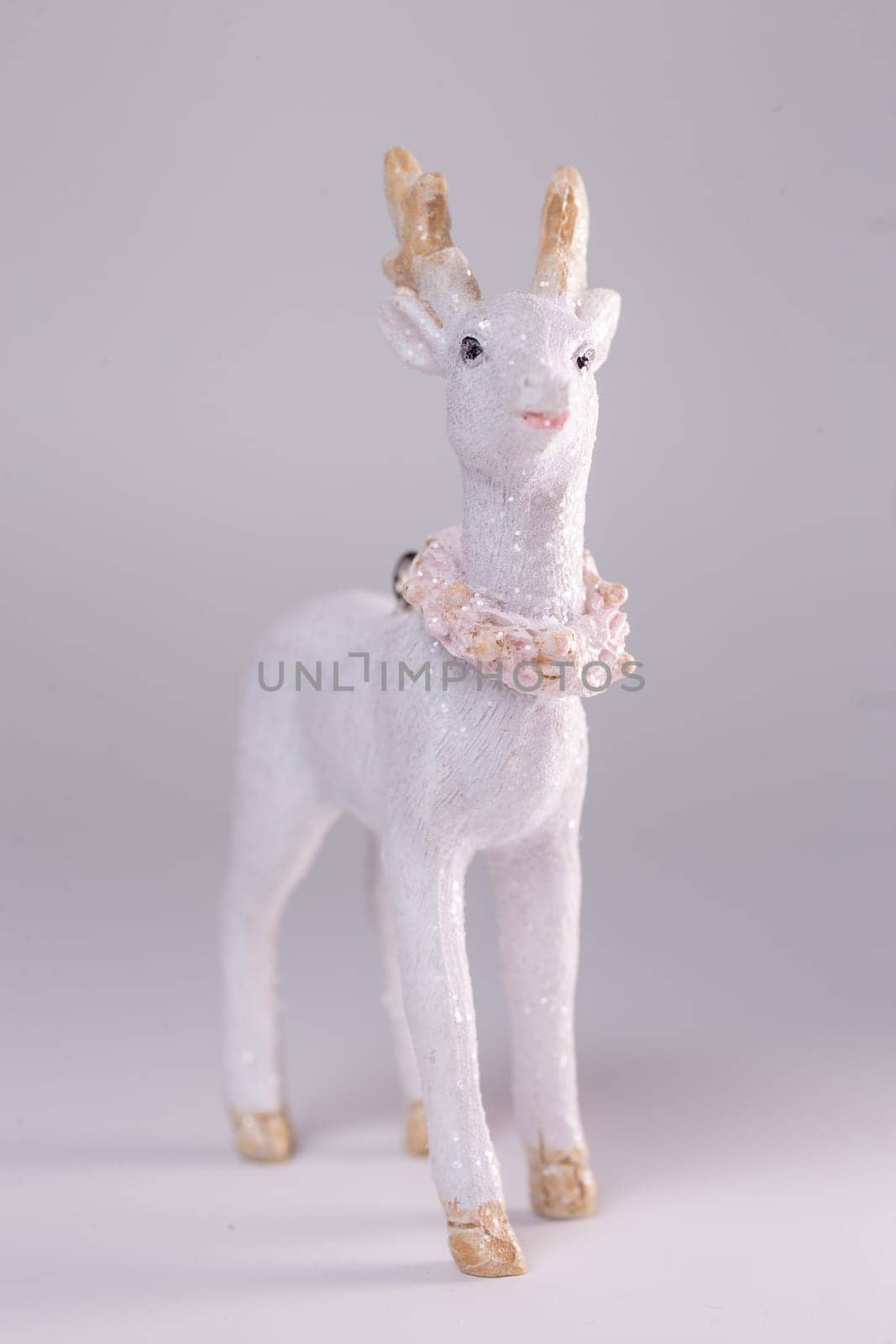 christmas tree toy white fawn on a white background by Pukhovskiy