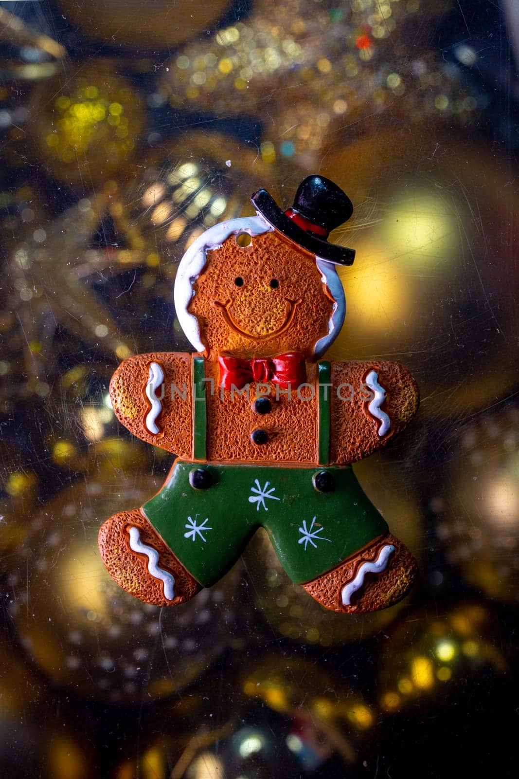 christmas toy gingerbread on the background of golden toys by Pukhovskiy