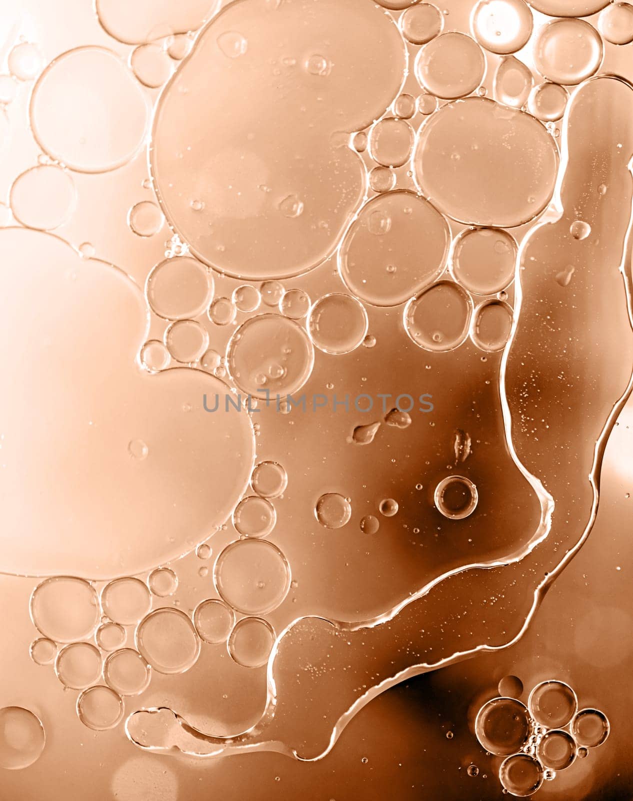 Color of the year 2024: Peach Fuzz. Abstract background. Bright colorful bubbles on water surface