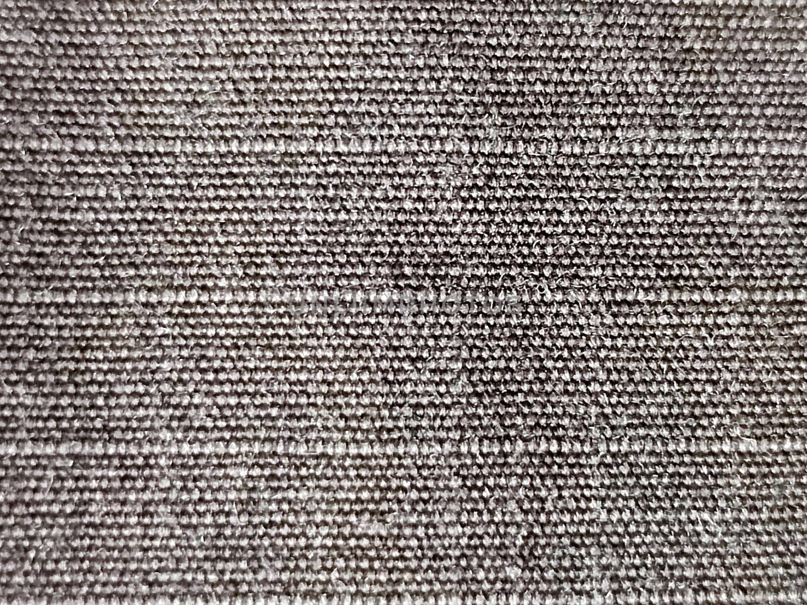 Beige raw cotton fabric for natural textile background.