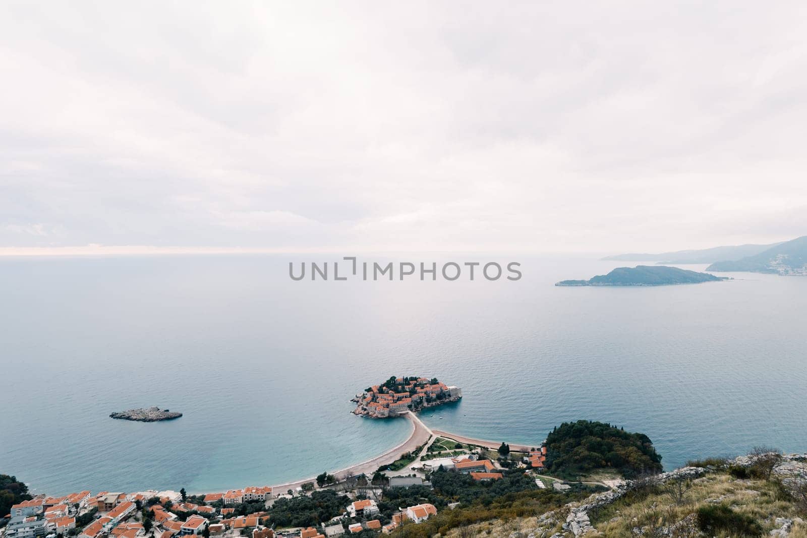 Island of Sveti Stefan in the Bay of Kotor, connected by an isthmus to the mainland. Top view. Montenegro. High quality photo