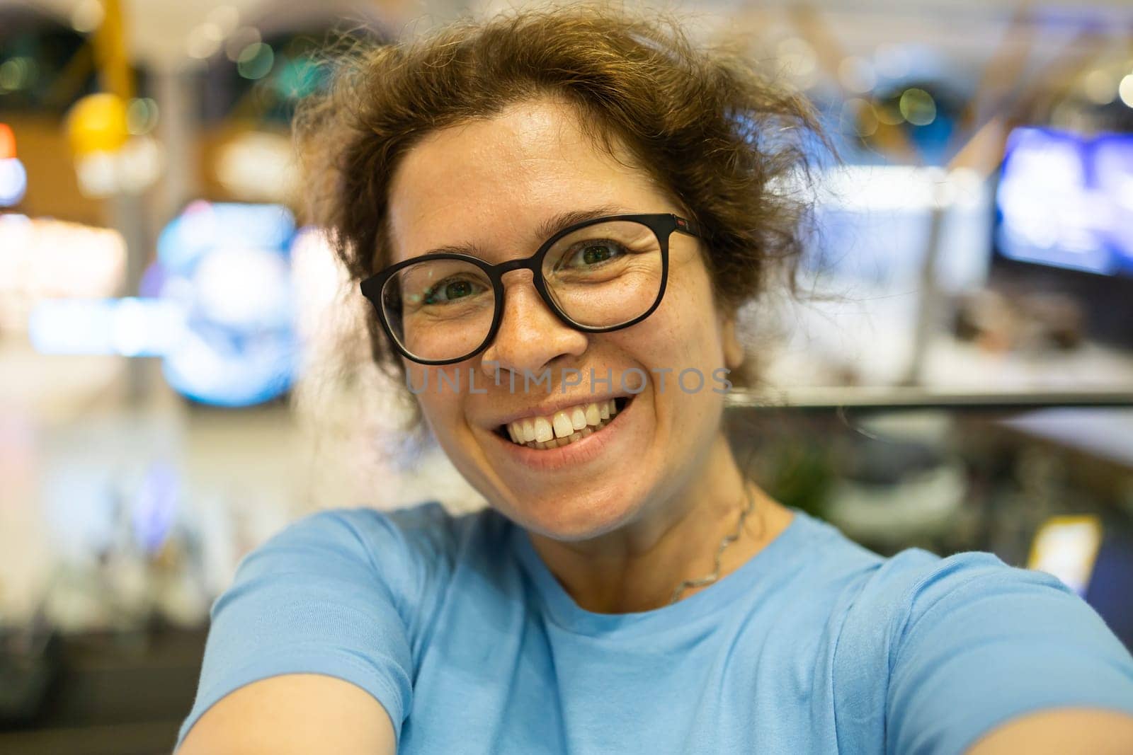 Video call portrait of excited cheerful smiling woman in spectacles taking selfie photo. Selfie and blogger