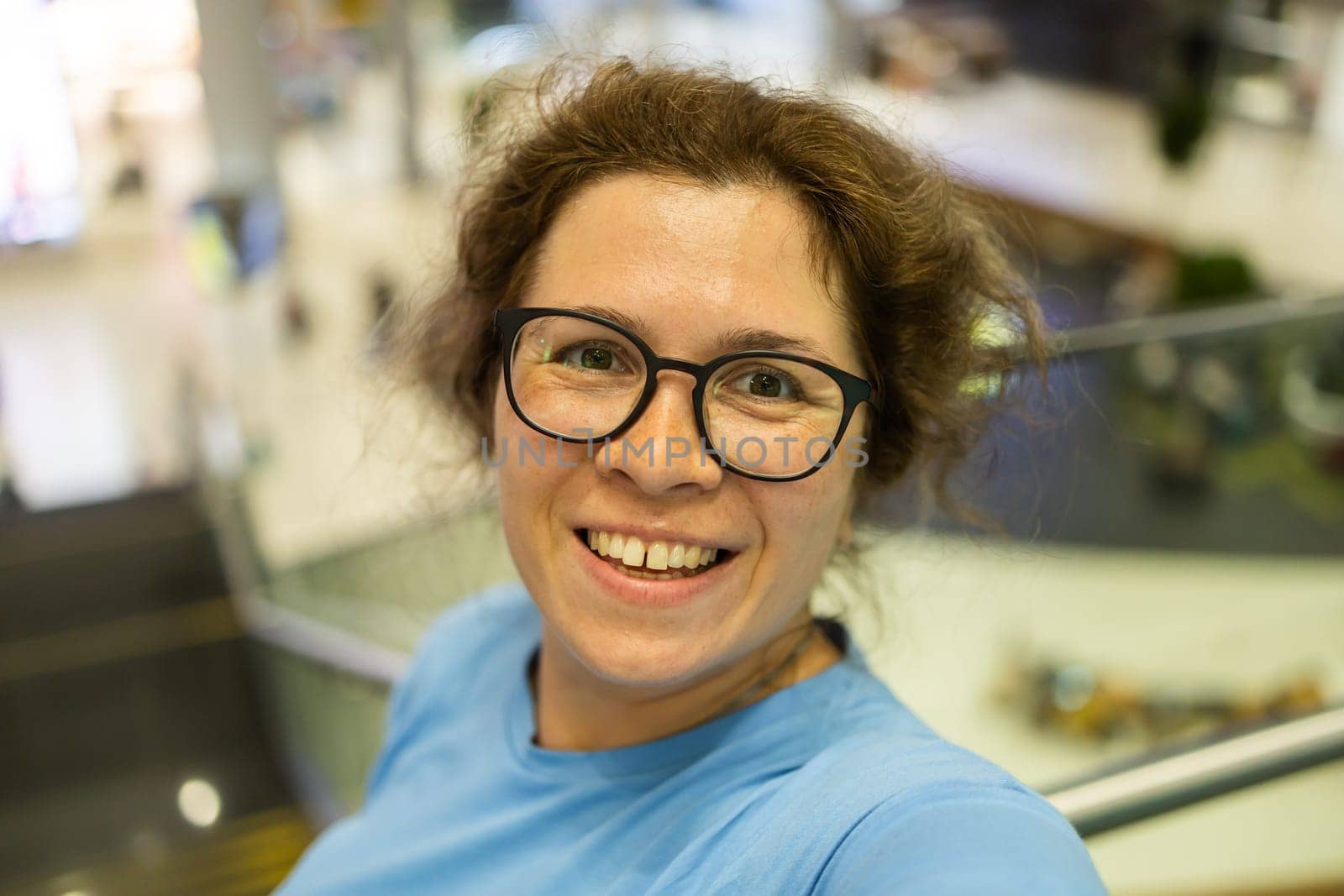 Video call portrait of excited cheerful smiling woman in spectacles taking selfie photo. Selfie and blogger