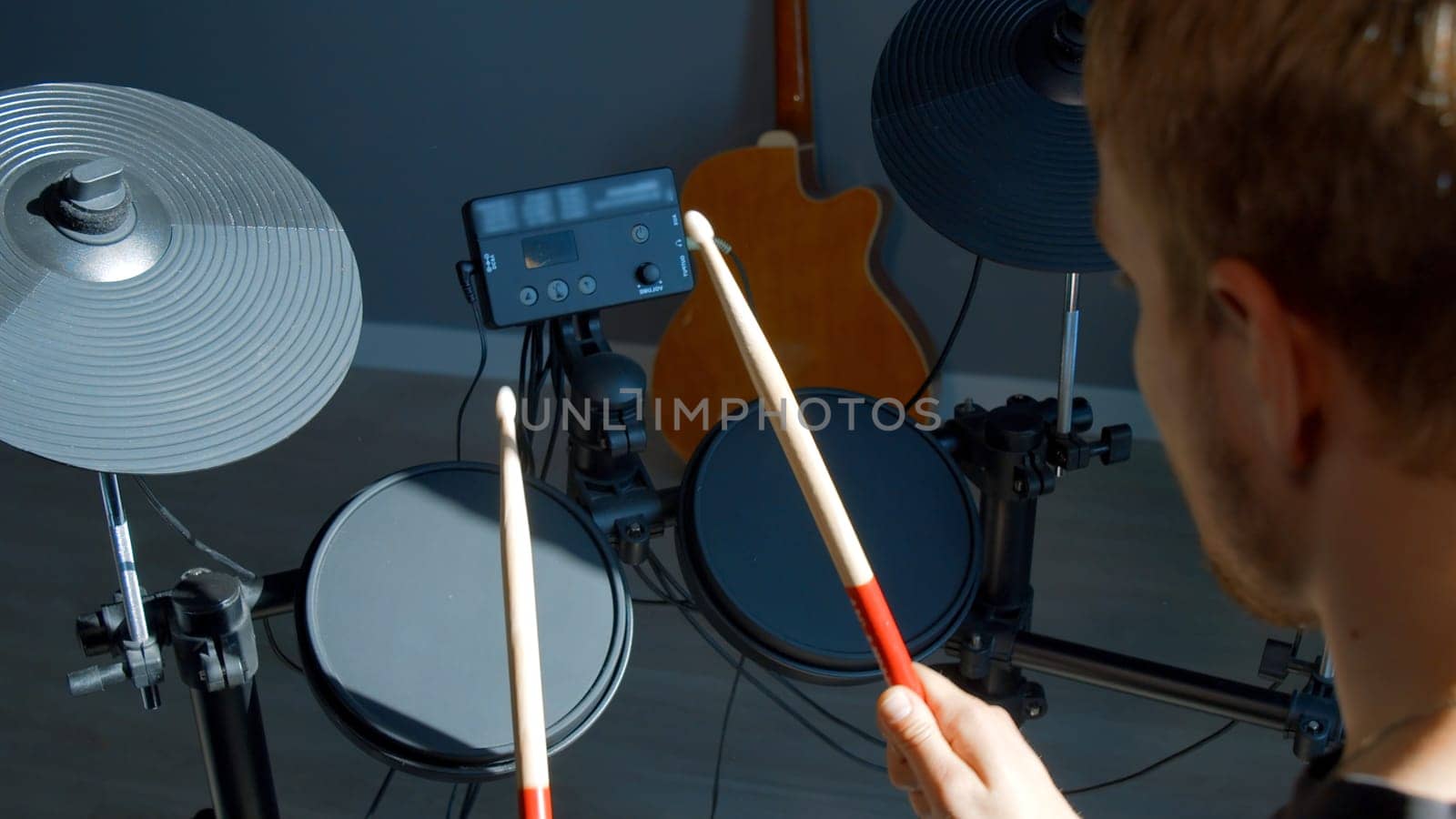 Unrecognizable musician hands hitting drum plates in recording studio. Media. Drummer hands performing solo with drumsticks