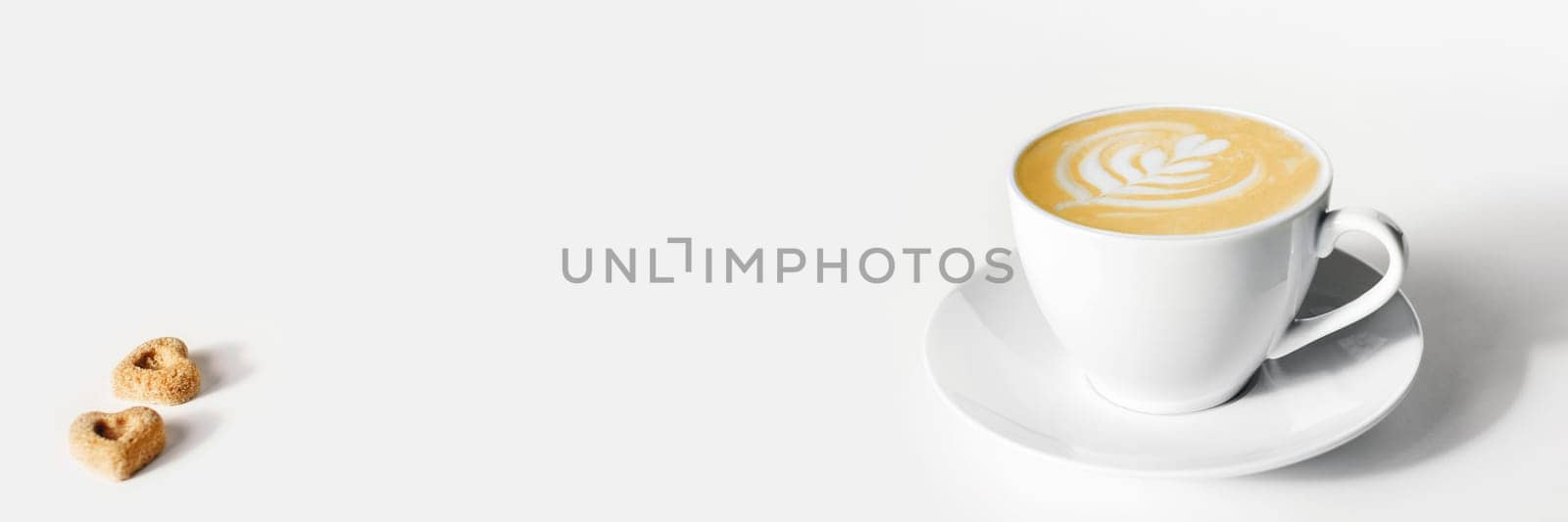 Web banner with white background: 2 pieces of sugar and cup of coffee. Flat lay with space for your text.