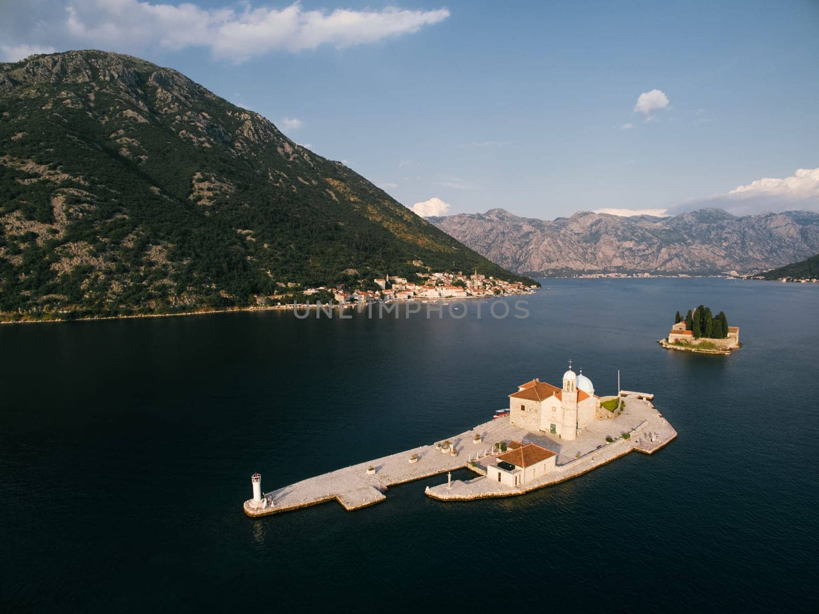 Church of Our Lady on the Rocks on a small artificial island in the Bay of Kotor. Montenegro. Aerial view. High quality photo