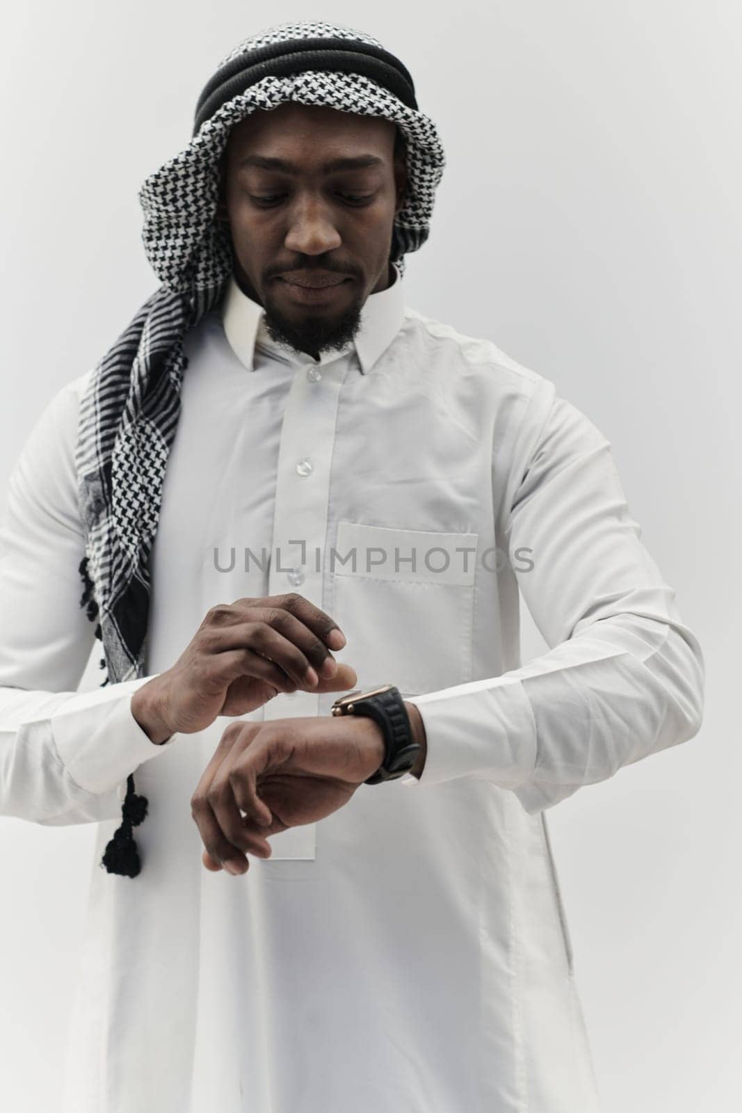 Arabic entrepreneur captures a self-portrait against an isolated white background, radiating ambition, determination, and corporate charisma, embodying the essence of a successful and influential business leader.