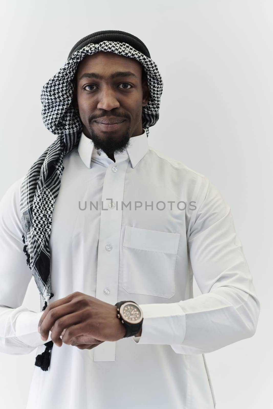 Arabic entrepreneur captures a self-portrait against an isolated white background, radiating ambition, determination, and corporate charisma, embodying the essence of a successful and influential business leader by dotshock