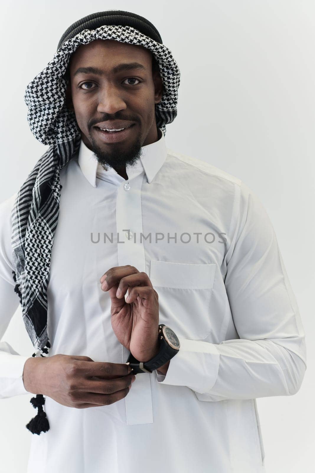 Arabic entrepreneur captures a self-portrait against an isolated white background, radiating ambition, determination, and corporate charisma, embodying the essence of a successful and influential business leader by dotshock