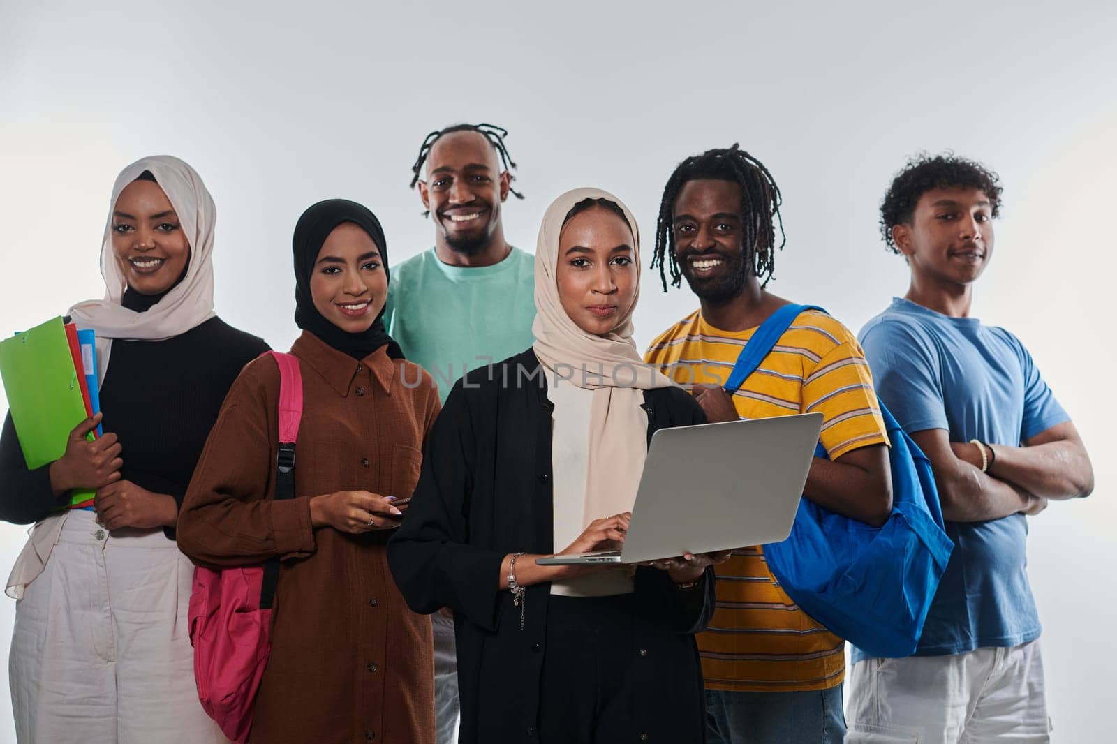 Group of diverse students engages in modern educational practices, utilizing a variety of technological tools such as laptops, tablets, and smartphones against a clean white background, exemplifying the contemporary approach to collaborative learning and information access.