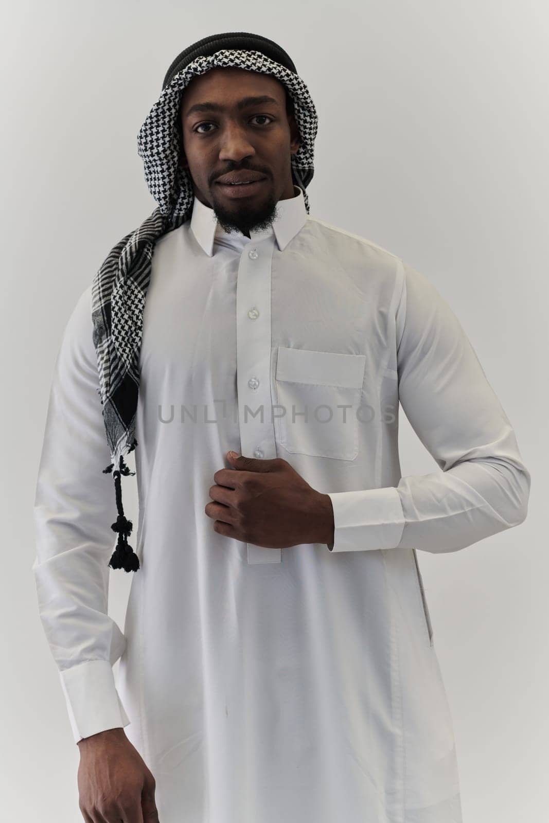 Arabic entrepreneur captures a self-portrait against an isolated white background, radiating ambition, determination, and corporate charisma, embodying the essence of a successful and influential business leader by dotshock