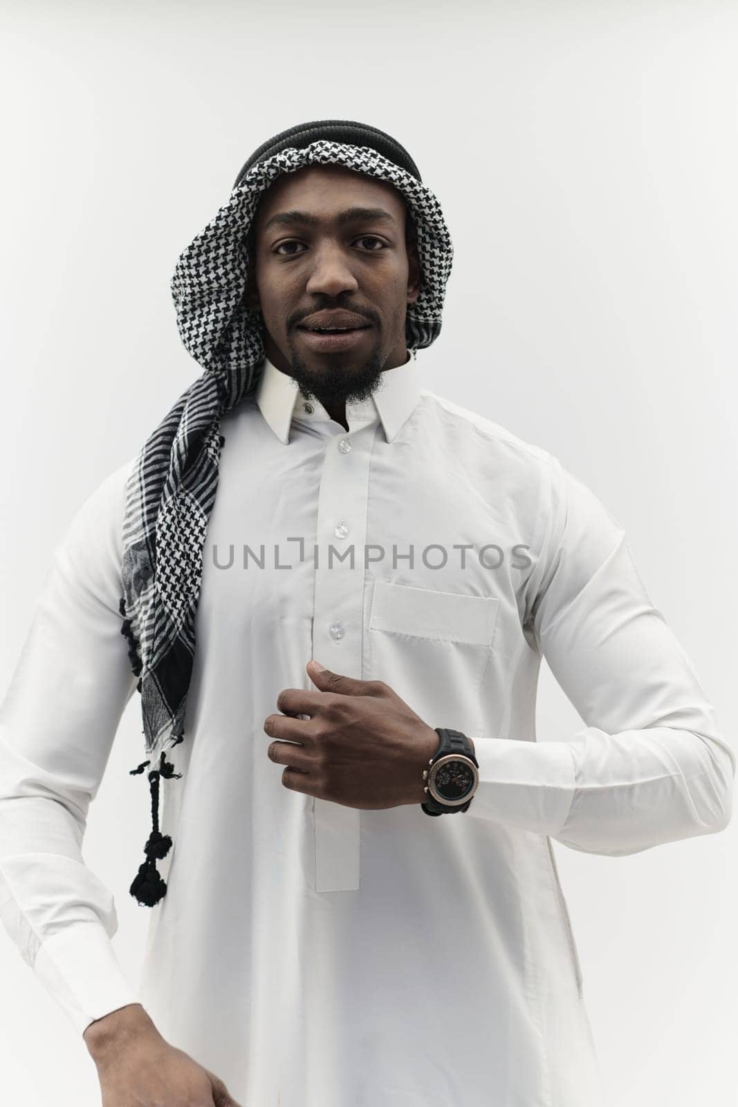 Arabic entrepreneur captures a self-portrait against an isolated white background, radiating ambition, determination, and corporate charisma, embodying the essence of a successful and influential business leader.