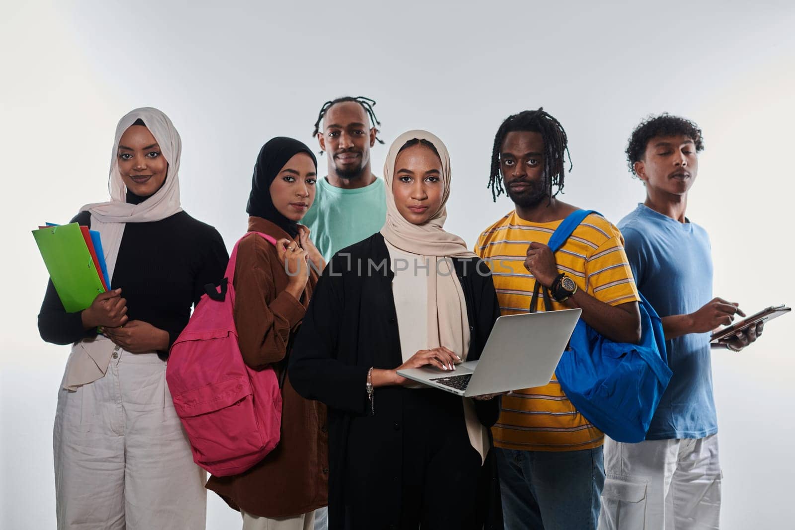 Group of diverse students engages in modern educational practices, utilizing a variety of technological tools such as laptops, tablets, and smartphones against a clean white background, exemplifying the contemporary approach to collaborative learning and information access.