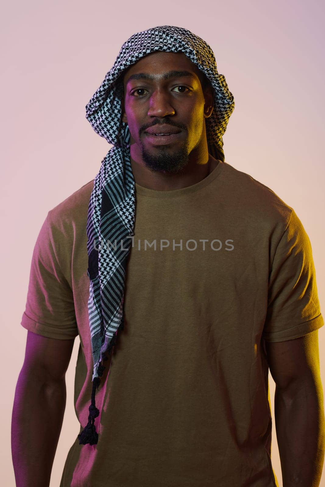 A resilient and charismatic African American man stands against a vibrant yellow gel background, donning a Palestinian scarf as a powerful symbol of defense, cultural identity, and solidarity, exuding confidence and determination in a striking and expressive portrait by dotshock