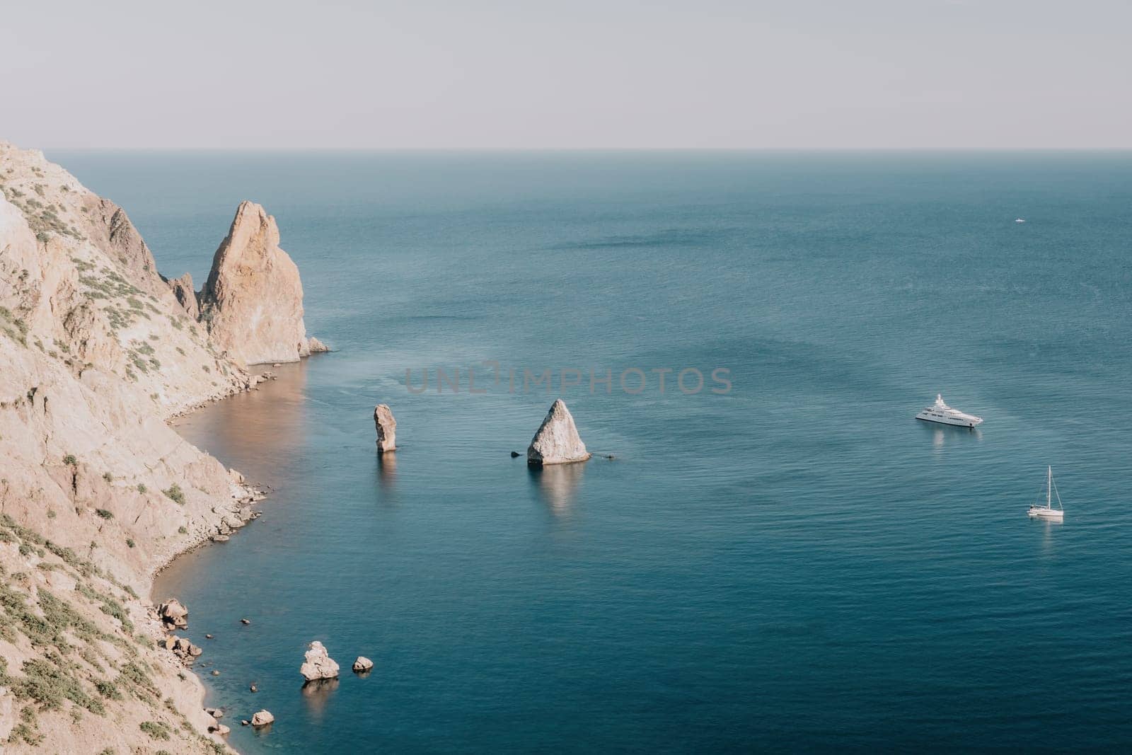 Aerial panoramic view of beautiful sunset above sea. Beautiful seascape. Sun glare, small waves on the water surface. Evening. Horizon. Nobody. No people. Copy space. Never-ending beauty of nature